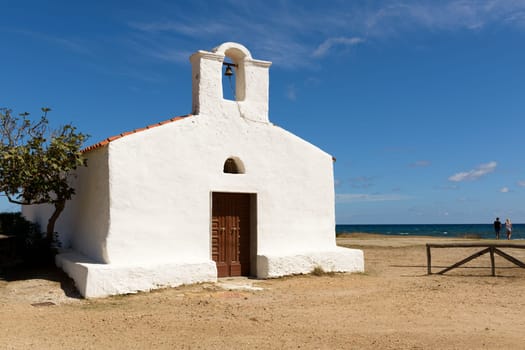 Posada, Italy - September 08, 2016: Posada - Church of Saint Lucia, Posada. North Sardinia. Small church with a single nave, the white facade with the entry portal which is surmounted by a large belfry.