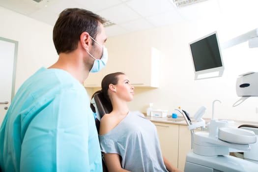 A young woman at her Dentists appointment.