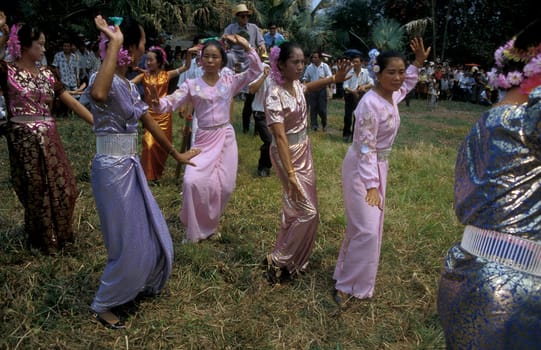 traditional dance at the spring and water festival near Jinghong in the region of Xishuangbanna in the province of Yunnan in china in east asia.