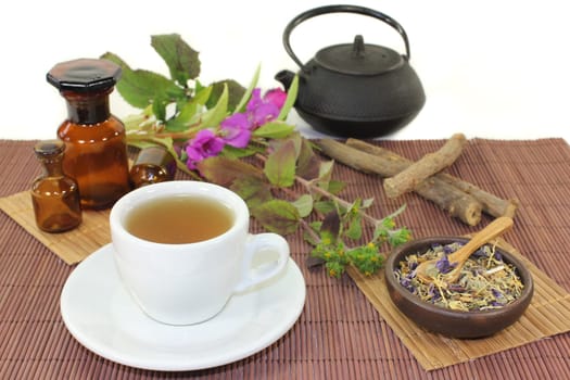 a cup of herbal tea and Chinese medicinal herbs