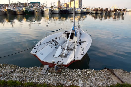 Motor Italian boat on the offshore berth Italy