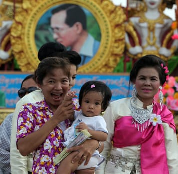 a pictures of the King Bhumibol on a traditional parade at the Raketfestival in the city of Yasothon in Thailand in Southeastasia.