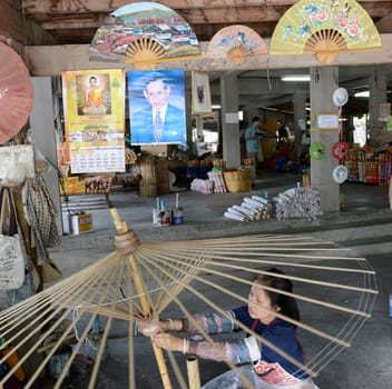 A picture of the King Bhumibol in an Umbrella Factory in the city of Chiang Mai in Thailand in Southeastasia.