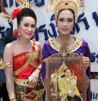 a pictures of the King Bhumibol on a traditional parade at the Raketfestival in the city of Yasothon in Thailand in Southeastasia.