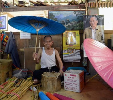 A picture of the King Bhumibol in an Umbrella Factory in the city of Chiang Mai in Thailand in Southeastasia.