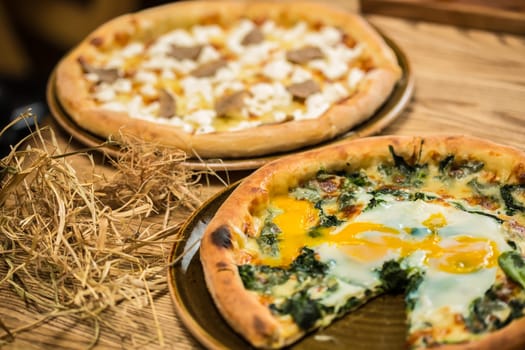 Margarita pizza with arugula and egg for breakfast, selective focus