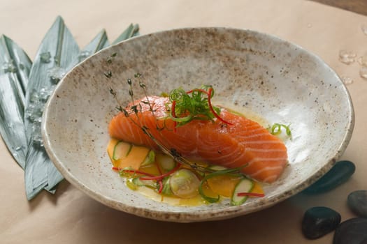Marinated salmon with green salad and spices.  Shallow dof.