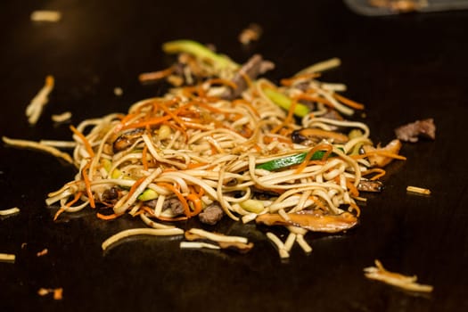 Preparing pad thai at a street hawker mobile restaurant in Bangkok, Thailand. Fried noodle. Shallow dof.