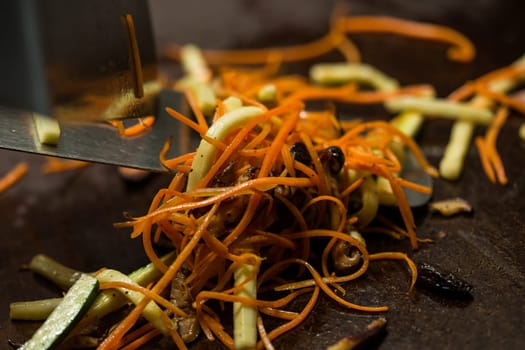 Preparing pad thai at a street hawker mobile restaurant in Bangkok, Thailand. Fried noodle. Shallow dof.