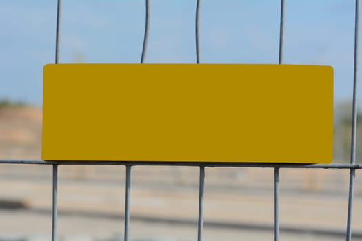 Construction fence with empty sign for free text