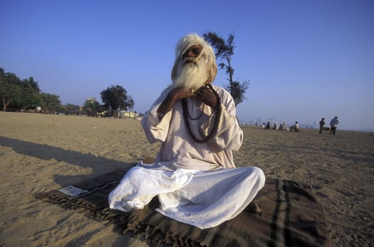 a Saddhu on the Chowpatty Beach in the city of Mumbai in India.