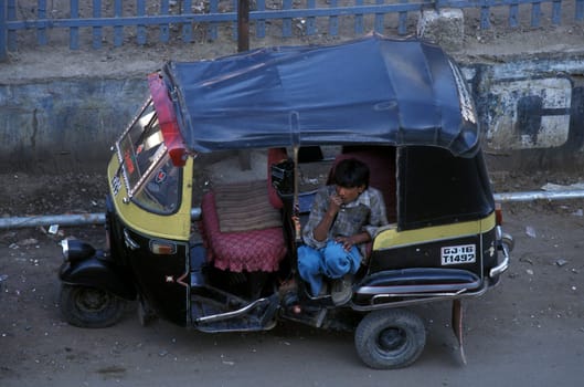 a Tuck Tuck Taxi in the city of Ahmedabad in the province Gujarat in India.