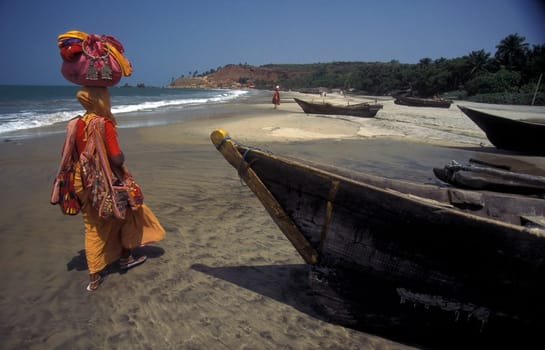 an Indian Saler at the beach of Colva in the Province Goa in India.