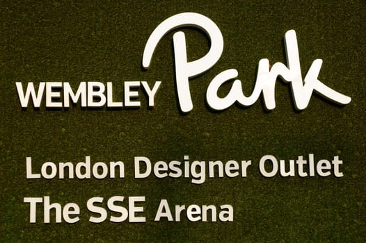 London,United Kingdom – November 28,2014: The sign of Wembley Park with the SSE Arena and an outlet centre on a nonwoven fabric on November 28,2014 in London.