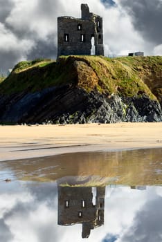 wild atlantic way castle and beach with beautiful reflections