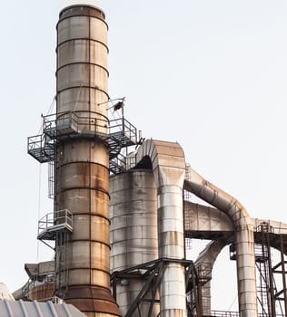 Chemical plant. Silos and smokestacks of a factory.