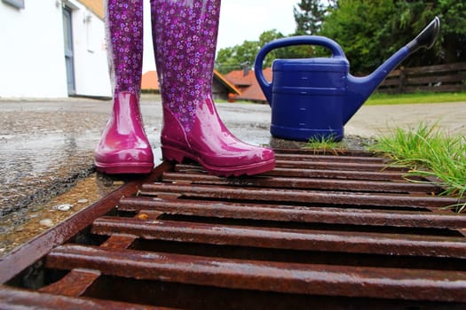 Colorful rubber boots in rainy weather