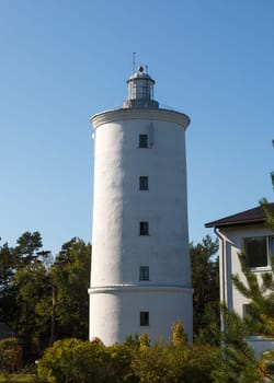 White Ovisi lighthouse tower with a beacon on top of it