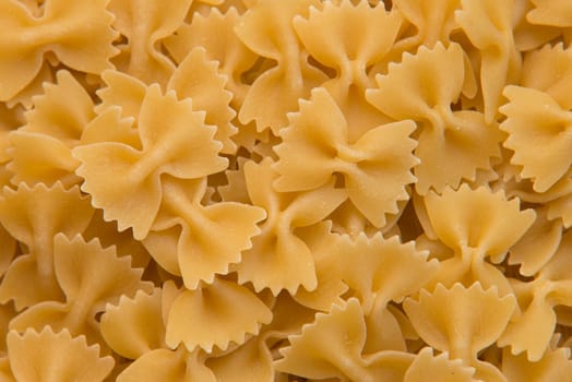 closeup of uncooked italian pasta - farfalle