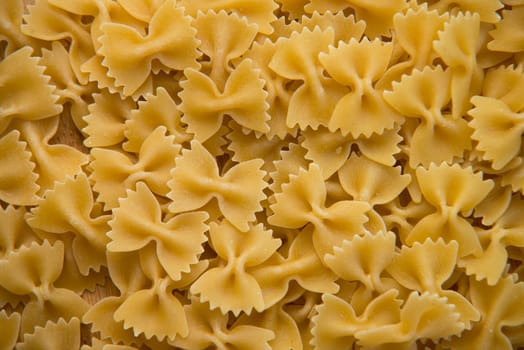closeup of uncooked italian pasta - farfalle