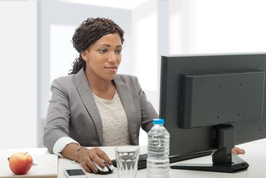 beautiful african american business woman working with computer