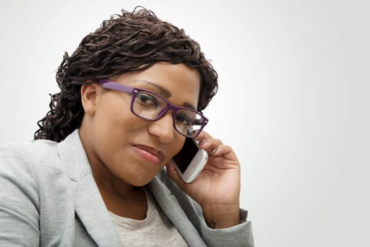 Portrait of a beautiful young african woman talking on cell phone