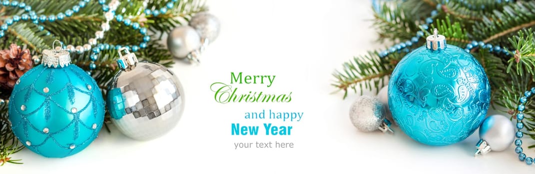 Turquoise and silver Christmas ornaments on white background