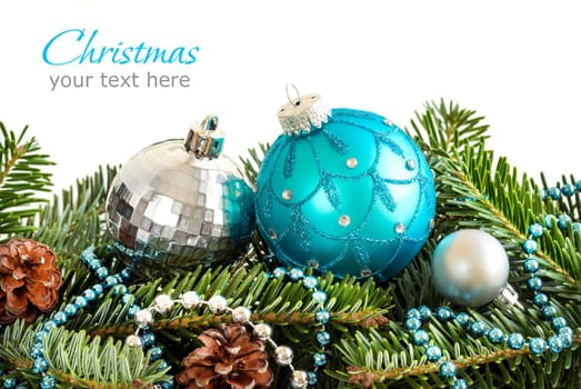 Turquoise and silver Christmas ornaments border on white background