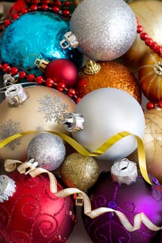 Colorful Christmas baubles in a wooden box