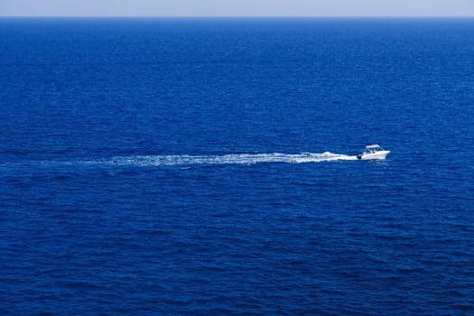 Fast motor boat with splash and wave.