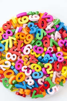 Colorful numbers made of wood as a background with text space
