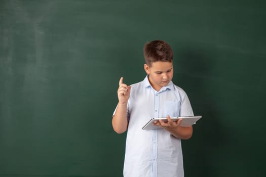 boy in a shirt with school boards