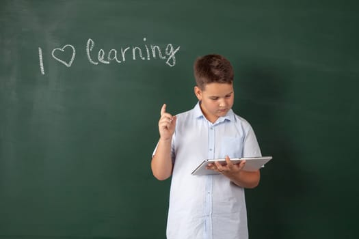 boy in a shirt with school boards