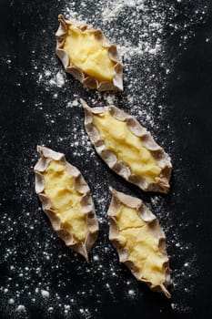 Traditional karelian pasties with potatoes before oven