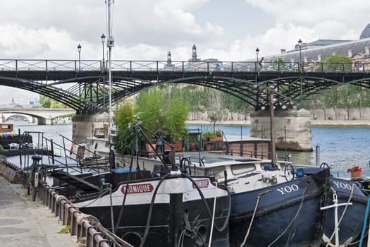 cargo ships on seine river near the pont des arts