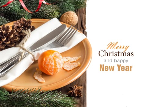 Festive table setting with spices and tangerine on wood