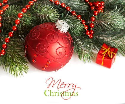 Festive decoration with red bauble and garland