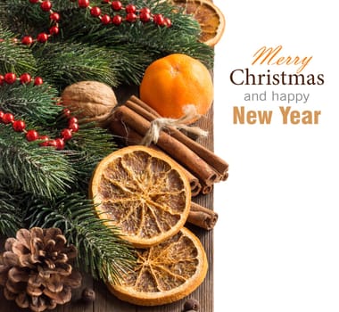 Christmas composition with spices, tangerine and branches