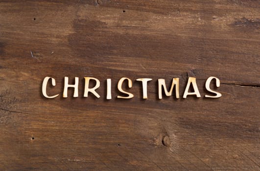 The word of christmas on a old wood