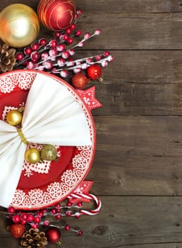 Festive table setting with Christmas decorations on wooden table