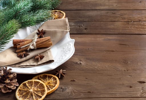 Festive table setting with spices on wood