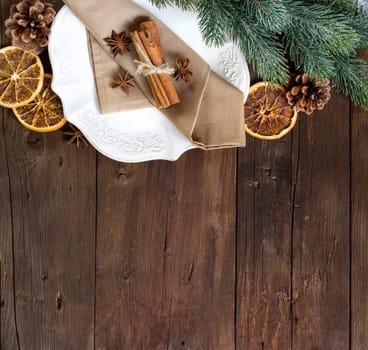 Festive table setting with spices on wooden table