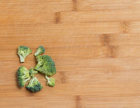  fresh broccoli solated on a wooden background