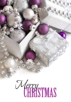 Silver and purple Christmas ornaments border on white background