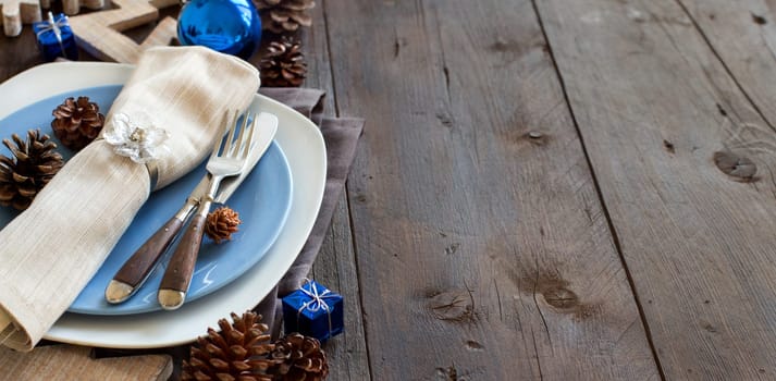 Christmas table setting with rustic decorations close up