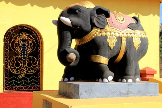 Bright, painted, cement elephant at Kudupu Shri Ananthapadmanabhaswami Temple, Mangalore, Karnataka, India, Asia