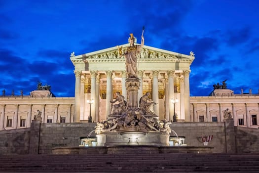 Pallas Athene fountain at night,illuminated landmark in front of the Austrian Parliament