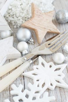 Silver and cream Christmas Table Setting with christmas decorations