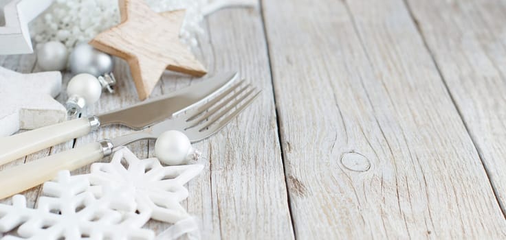 Silver and cream Christmas Table Setting with christmas decorations