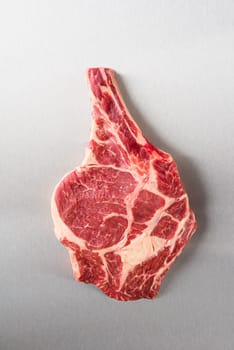 Dry aged Rib eye steak on stainless steel